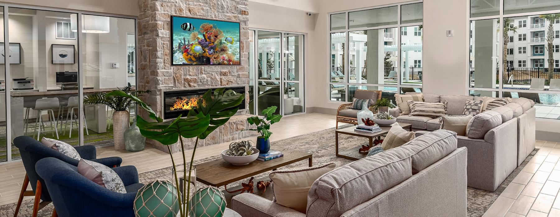 a living room with a stone fireplace